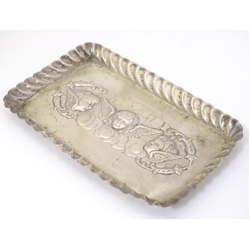 324 - A silver dressing table tray with embossed angel decoration. Hallmarked Birmingham 1902 maker Henry ... 