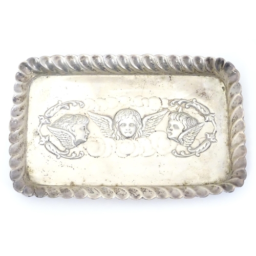 324 - A silver dressing table tray with embossed angel decoration. Hallmarked Birmingham 1902 maker Henry ... 