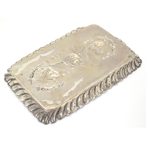 324 - A silver dressing table tray with embossed angel decoration. Hallmarked Birmingham 1902 maker Henry ... 