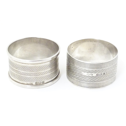 331 - Two silver napkin rings both with engine turned decoration, one hallmarked Birmingham 1927, maker F.... 