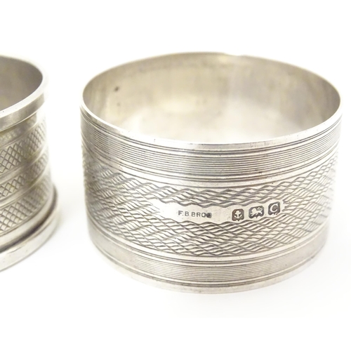 331 - Two silver napkin rings both with engine turned decoration, one hallmarked Birmingham 1927, maker F.... 