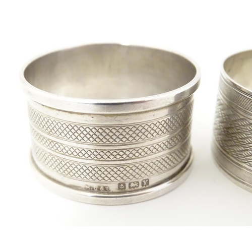 331 - Two silver napkin rings both with engine turned decoration, one hallmarked Birmingham 1927, maker F.... 