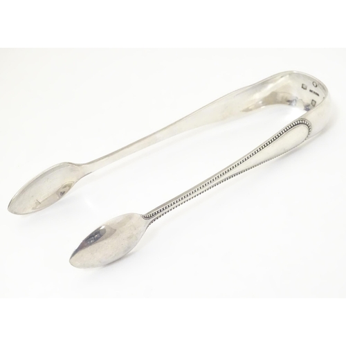 332 - Victorian Scottish silver sugar tongs hallmarked Glasgow 1873, maker John Miller & Co.  Approx. 6