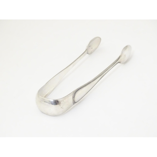 332 - Victorian Scottish silver sugar tongs hallmarked Glasgow 1873, maker John Miller & Co.  Approx. 6