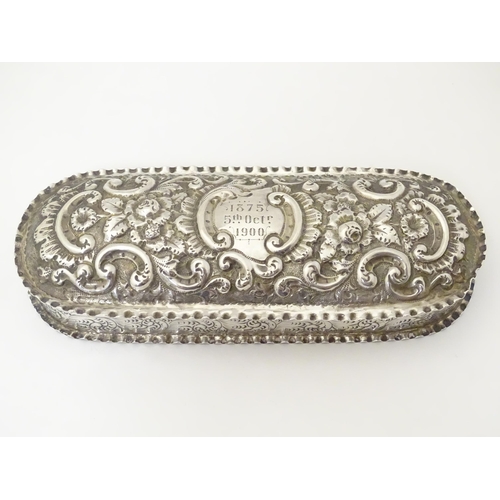 333 - A Victorian silver dressing table box with embossed decoration and hinged lid, hallmarked Chester 18... 