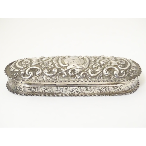 333 - A Victorian silver dressing table box with embossed decoration and hinged lid, hallmarked Chester 18... 