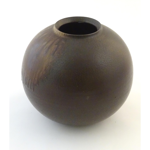 35 - A Japanese vase of globular form with a drip glaze. Approx. 10 3/4