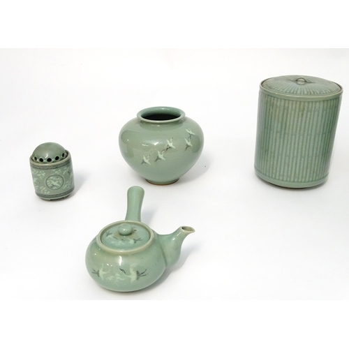 52 - A large quantity of Oriental ceramic wares with a celadon style glaze, to include a globular vase, t... 