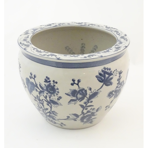 61 - A Chinese blue and white planter / jardiniere with floral and foliate detail, the interior decorated... 