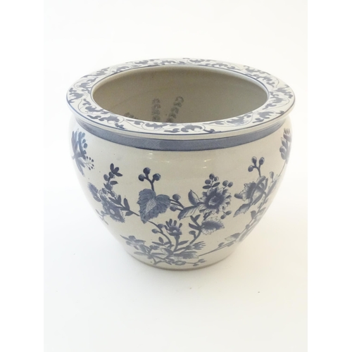 61 - A Chinese blue and white planter / jardiniere with floral and foliate detail, the interior decorated... 