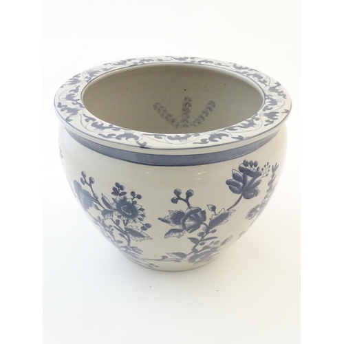 61 - A Chinese blue and white planter / jardiniere with floral and foliate detail, the interior decorated... 