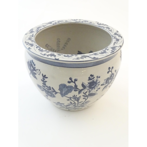 61 - A Chinese blue and white planter / jardiniere with floral and foliate detail, the interior decorated... 