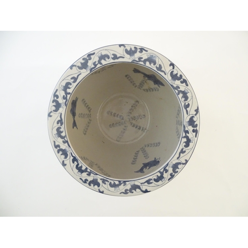 61 - A Chinese blue and white planter / jardiniere with floral and foliate detail, the interior decorated... 