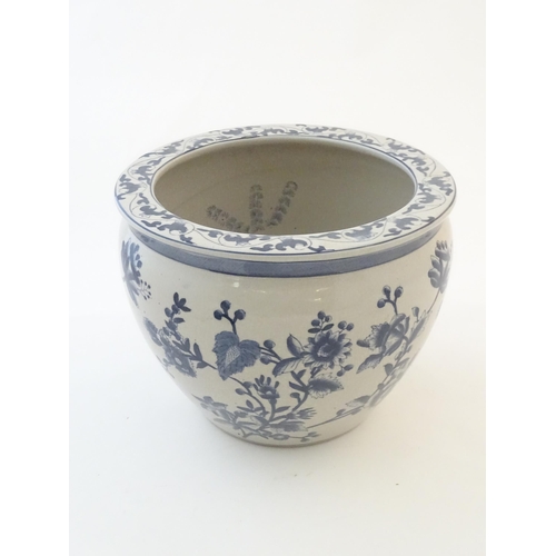 61 - A Chinese blue and white planter / jardiniere with floral and foliate detail, the interior decorated... 