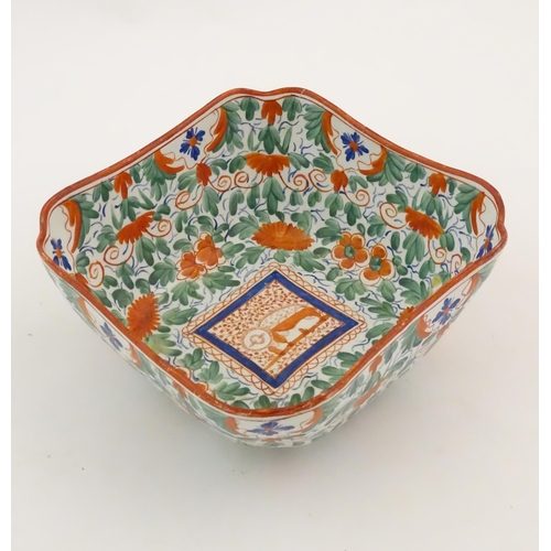 70 - A Minton squared bowl in the Crazy Cow pattern with flowers, foliage and central stylised animal det... 