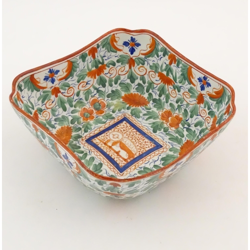 70 - A Minton squared bowl in the Crazy Cow pattern with flowers, foliage and central stylised animal det... 