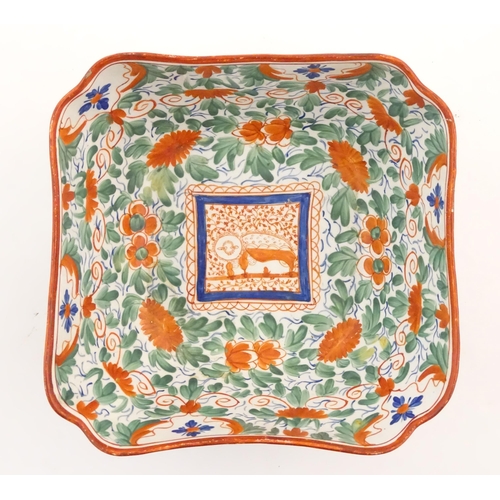 70 - A Minton squared bowl in the Crazy Cow pattern with flowers, foliage and central stylised animal det... 