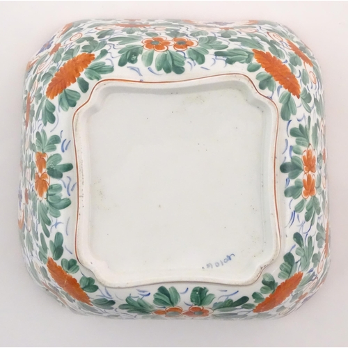 70 - A Minton squared bowl in the Crazy Cow pattern with flowers, foliage and central stylised animal det... 