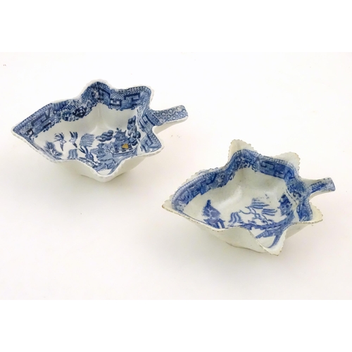 73 - Two blue and white pickle dishes decorated with pagoda buildings, birds, figures and a bridge. Large... 