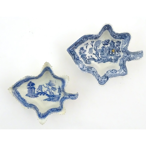 73 - Two blue and white pickle dishes decorated with pagoda buildings, birds, figures and a bridge. Large... 