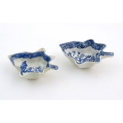 73 - Two blue and white pickle dishes decorated with pagoda buildings, birds, figures and a bridge. Large... 