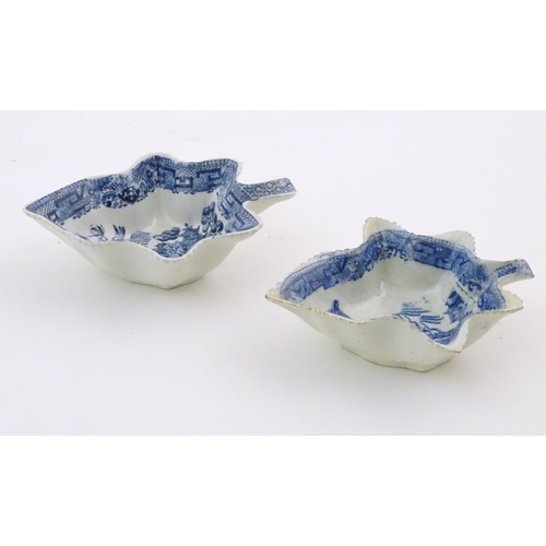 73 - Two blue and white pickle dishes decorated with pagoda buildings, birds, figures and a bridge. Large... 