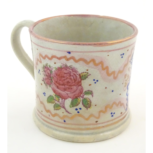 74 - A Sunderland lustre mug with hand painted rose flower detail. Approx. 3