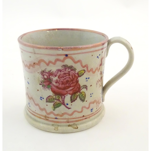 74 - A Sunderland lustre mug with hand painted rose flower detail. Approx. 3