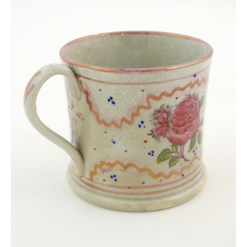 74 - A Sunderland lustre mug with hand painted rose flower detail. Approx. 3