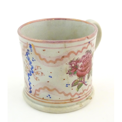 74 - A Sunderland lustre mug with hand painted rose flower detail. Approx. 3