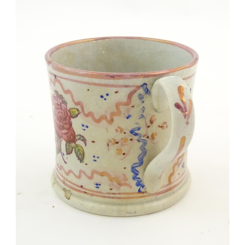 74 - A Sunderland lustre mug with hand painted rose flower detail. Approx. 3