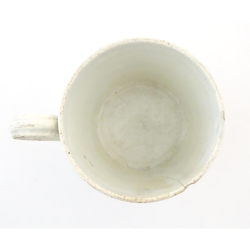 74A - A proverb mug / cup with a scrolled cartouche with the verse: Whoso mocketh the poor reproacheth his... 