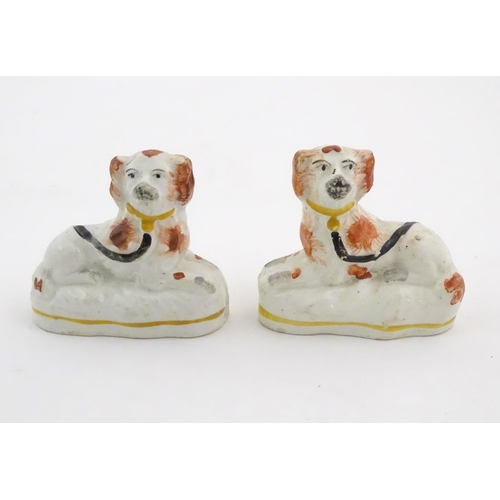 80 - A pair of Victorian Staffordshire pottery seated spaniel dogs. Approx. 2 3/4