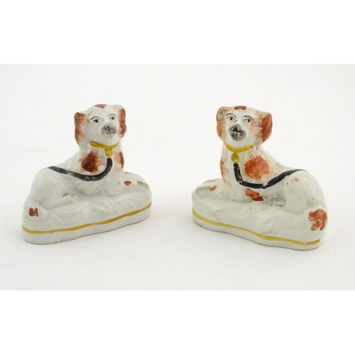 80 - A pair of Victorian Staffordshire pottery seated spaniel dogs. Approx. 2 3/4