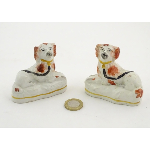 80 - A pair of Victorian Staffordshire pottery seated spaniel dogs. Approx. 2 3/4