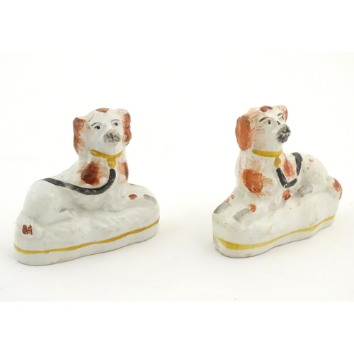 80 - A pair of Victorian Staffordshire pottery seated spaniel dogs. Approx. 2 3/4