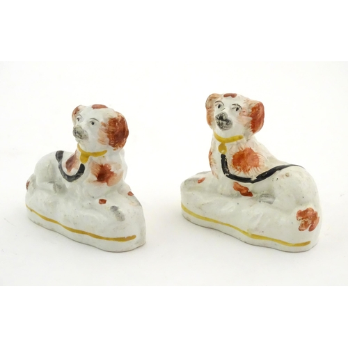 80 - A pair of Victorian Staffordshire pottery seated spaniel dogs. Approx. 2 3/4