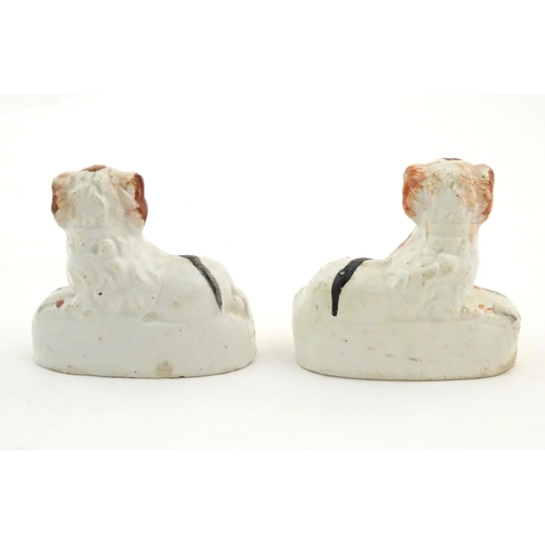 80 - A pair of Victorian Staffordshire pottery seated spaniel dogs. Approx. 2 3/4