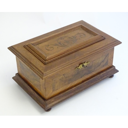 1188 - A 20thC Continental jewellery box of casket form with scroll detail to lid and fitted lift out tray ... 