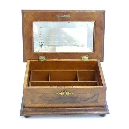 1188 - A 20thC Continental jewellery box of casket form with scroll detail to lid and fitted lift out tray ... 