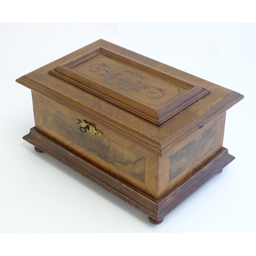 1188 - A 20thC Continental jewellery box of casket form with scroll detail to lid and fitted lift out tray ... 