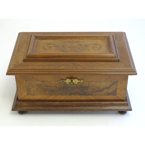 1188 - A 20thC Continental jewellery box of casket form with scroll detail to lid and fitted lift out tray ... 