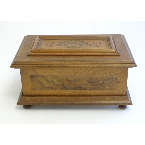 1188 - A 20thC Continental jewellery box of casket form with scroll detail to lid and fitted lift out tray ... 