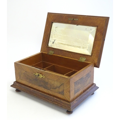 1188 - A 20thC Continental jewellery box of casket form with scroll detail to lid and fitted lift out tray ... 