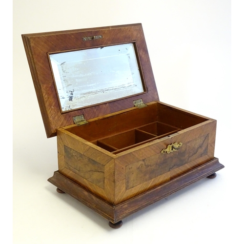 1188 - A 20thC Continental jewellery box of casket form with scroll detail to lid and fitted lift out tray ... 