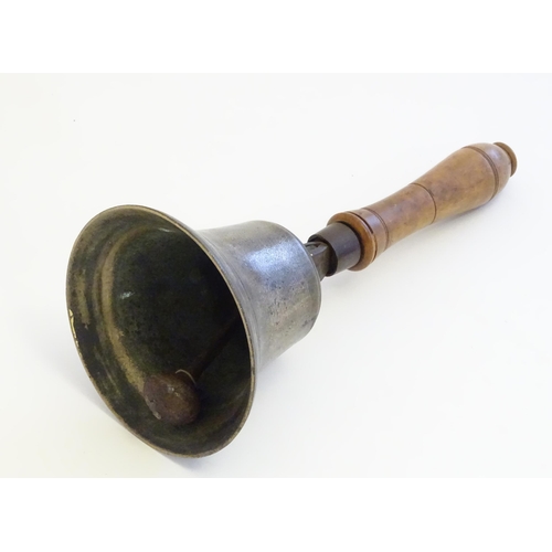 1189 - A 20thC hand bell with turned fruitwood handle with banded detail. Approx. 12 1/2