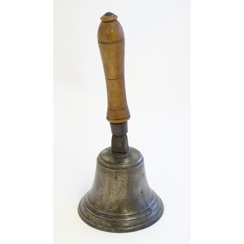 1189 - A 20thC hand bell with turned fruitwood handle with banded detail. Approx. 12 1/2