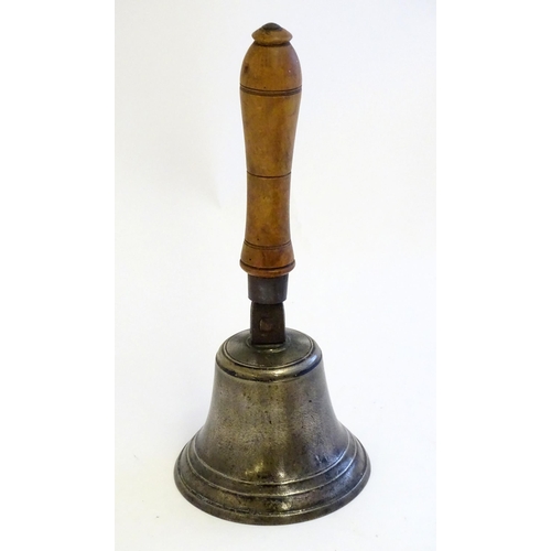 1189 - A 20thC hand bell with turned fruitwood handle with banded detail. Approx. 12 1/2