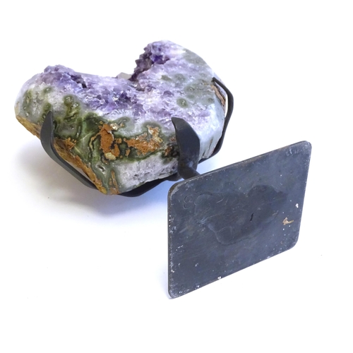 1207 - An amethyst crystal geode with polished edge. Mounted on a stand. Amethyst approx. 7 3/4