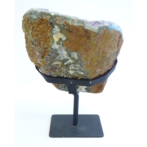 1207 - An amethyst crystal geode with polished edge. Mounted on a stand. Amethyst approx. 7 3/4